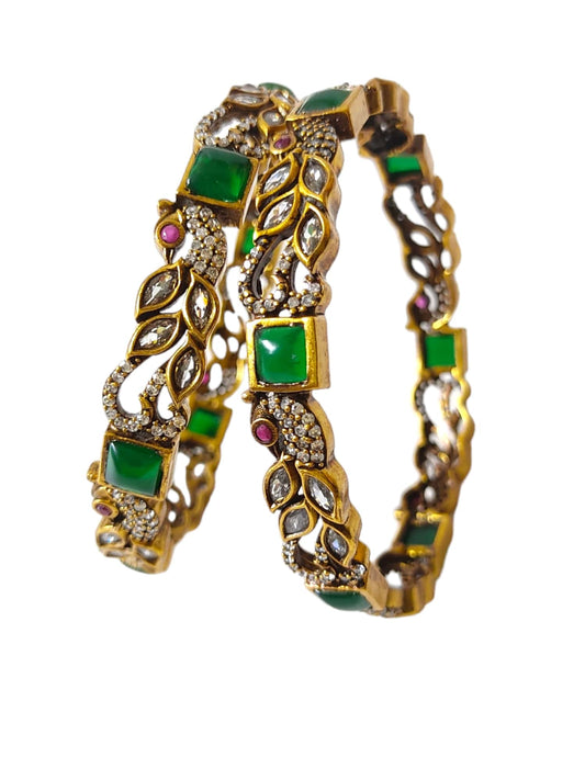 victorian bangles with white stones and parrot design