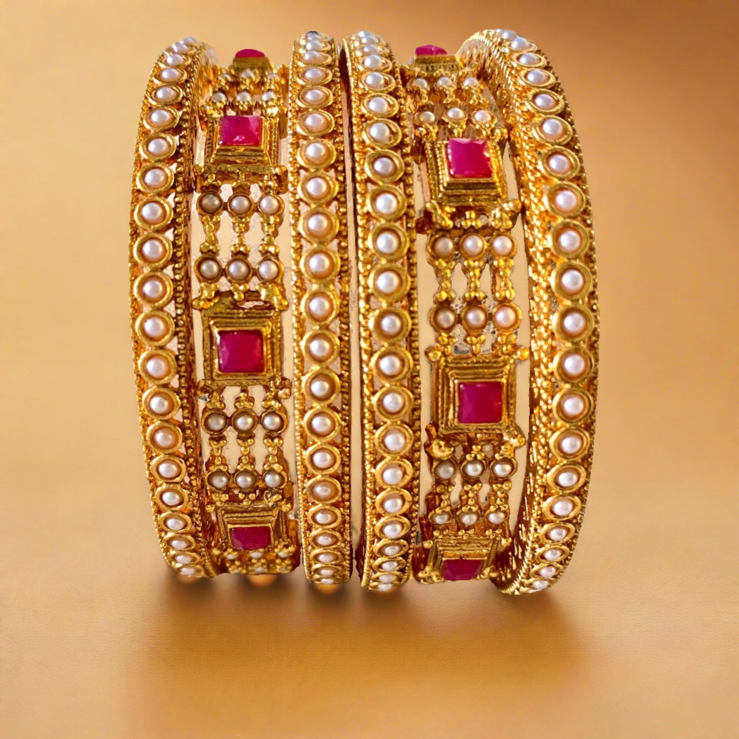 pearl bangle with red stones