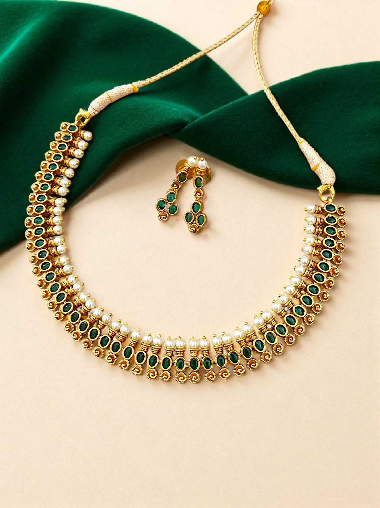 Green stone necklace set with pearls