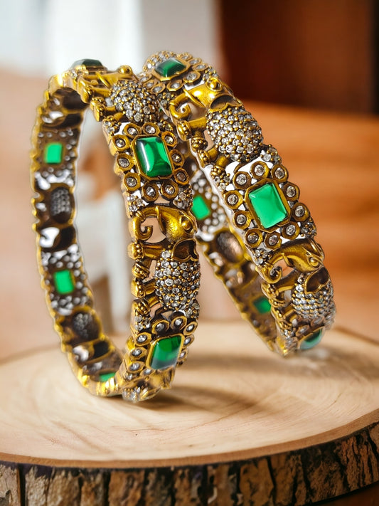 victorian polish bangles with elephant design and green stones
