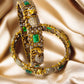 victorian polish bangles with elephant design and green stones