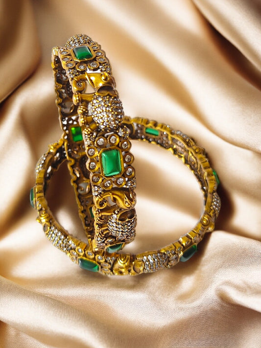 victorian polish bangles with elephant design and green stones
