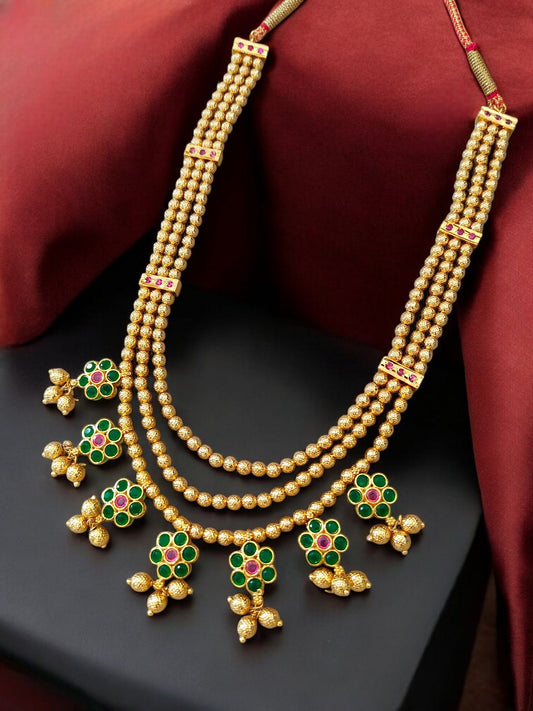 Gold plated layered necklace with green stones