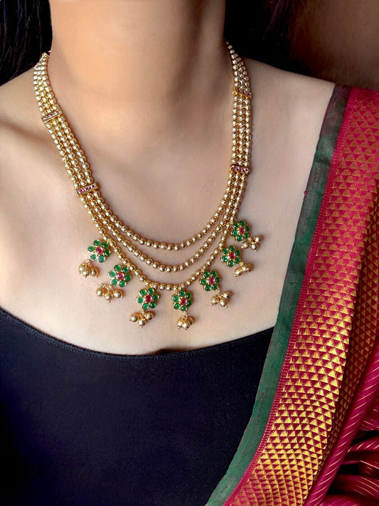 Gold plated layered necklace with green stones